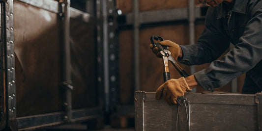 Authorized worker safely positioning a cutter on a bolt seal